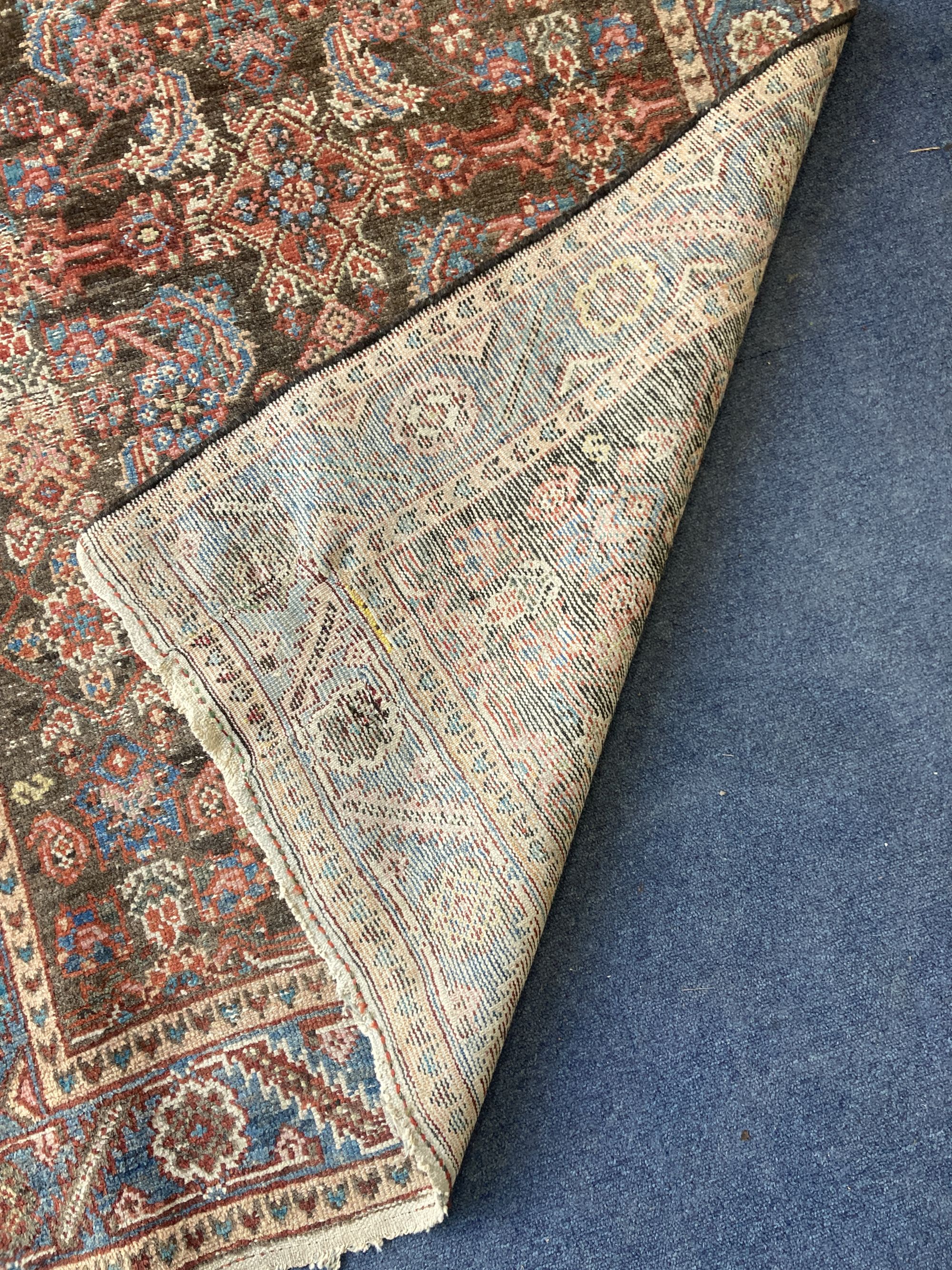A Caucasian Feraghan brown ground runner, 300 x 106cm